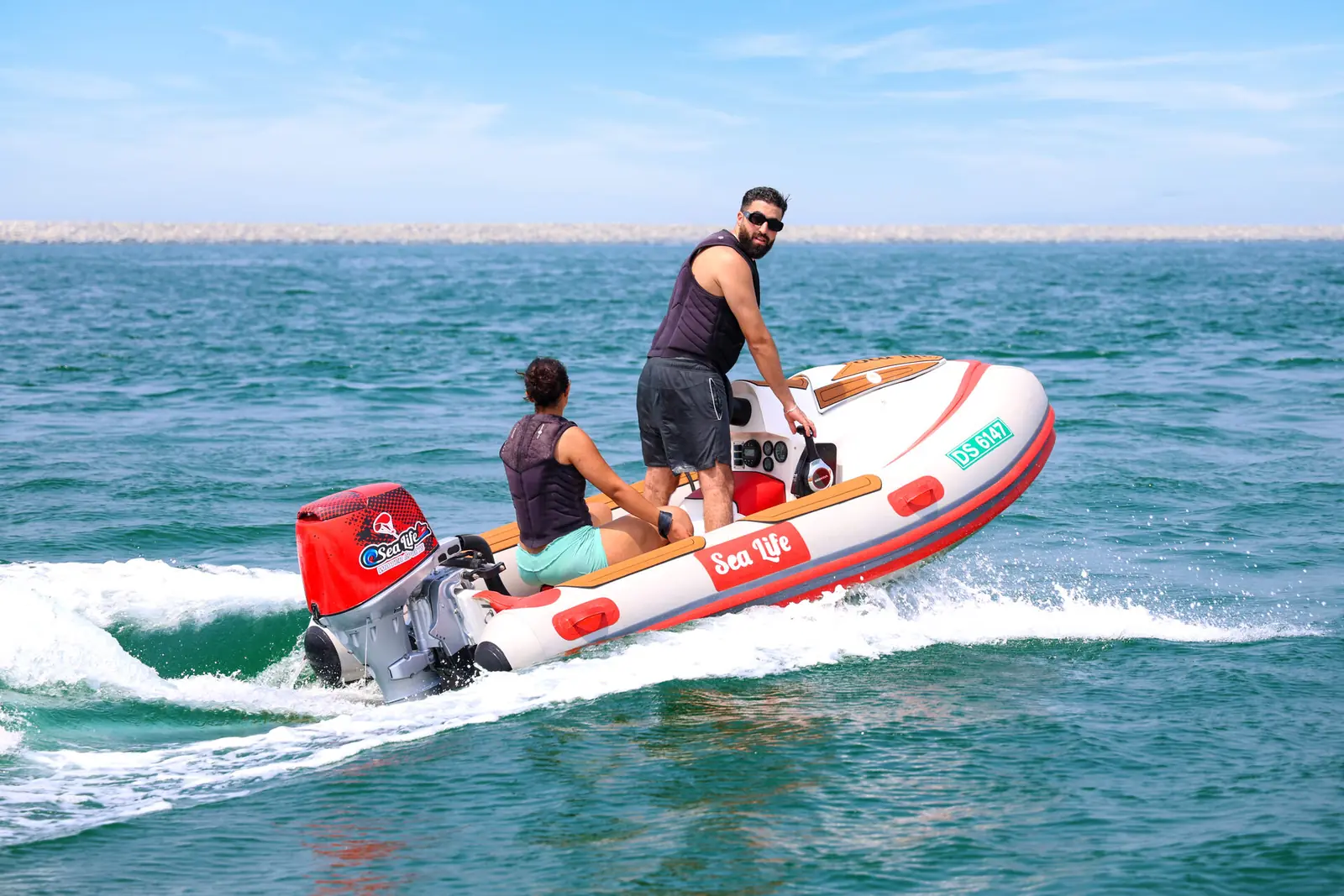Small boat on a guided self-drive tour in Dubai, a way for visitors to take the wheel without a boat licence